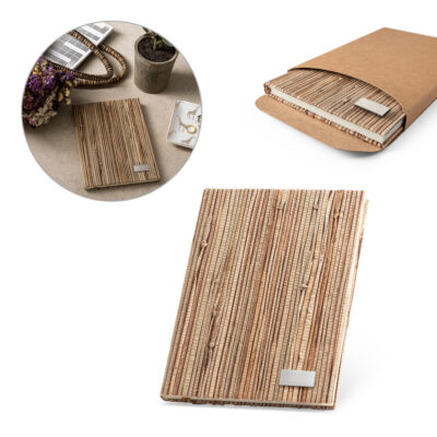 Caderno A5 de capa dura em palha natural com páginas pautadas recicladas